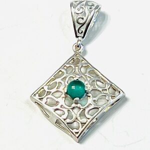 This is an Ariva sterling silver green chalcedony vine pendant.